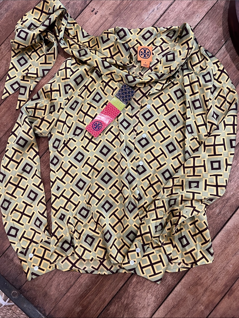 " Tory Burch Silk Geometric Bow Blouse NWT
Size 4 
Bow blouse